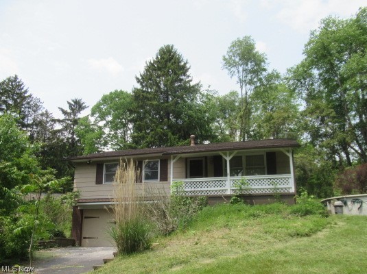 **REDUCED** Don't Miss This Ranch Home situated on 1.07 Acres - House Parcel and Two Additional Parcels. (Taxes reflect all three parcels). This Home Features a Partially Finished Walk Out Basement with a Rec Room, Full Bath, and Laundry Area. Attached Two Car Garage with openers. The Upper Floor Features Three Bedrooms with Full Community Bath and a Half Bath off the Master with access from the Kitchen. This Home has so many possibilities for Updating just as you would like it! Large Wooded Parcels with Unlimited Landscaping potential! You don't want to miss this one! It will not last long in this Market! AGENTS: See Broker Remarks for Placing your offers. Property is to be Sold AS-IS. Seller makes no repair.