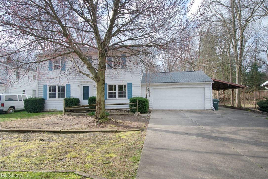 Spacious 2-story Colonial home tucked away near the beautiful Portage Lakes, Green LSD. This charming home features four bedrooms, 2 1/2 baths, a covered patio, a partially finished basement, and lots of storage space. The open-concept great room offers loads of natural light and is open to the bright dining room. The kitchen offers a window overlooking the backyard, plenty of cabinets, and a dual-sided sink. The oversized mudroom has built-in cabinets, large windows, access to the 2-car garage, and a convenient half bath. The serene backyard offers a covered patio and is perfect for entertaining. Finishing the main floor is the cozy family room great for family gatherings. 4 large bedrooms and two full baths, including the master suite, are on the upper level. The master suite offers an abundance of natural light, a private master bath with a large vanity, and a tile walk-in shower. The partially finished basement has a large rec room with built-in storage, a workbench with shelving,