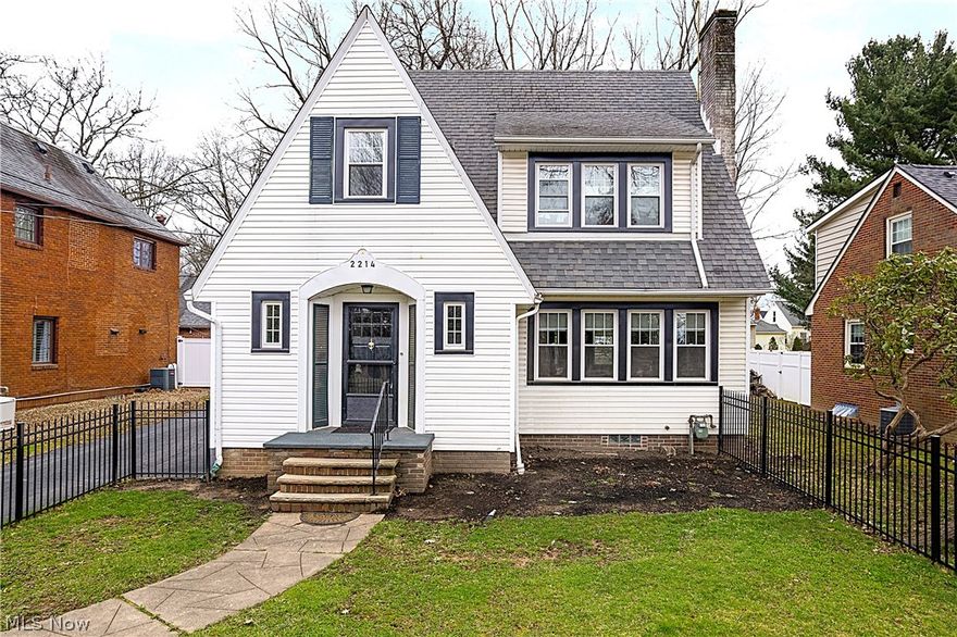 Charming 1930s home filled with timeless character and original details throughout! This 3 bedroom, 1.5 bath home features beautiful original woodwork, hardwood floors throughout, an impressive foyer, and many original light fixtures that add to its old-world appeal. The spacious living room offers a gas log fireplace and built-in bookshelves, while the formal dining room is perfect for gatherings. Between the kitchen and dining room, you’ll find a butler’s pantry and a cozy breakfast nook for added convenience and charm. The third floor includes a 29x10 bonus room with closet, offering great flexibility for additional living space, office, hobby room, or guest area. Enjoy central air, a fenced front yard, and extra paved parking behind the home. Range and refrigerator are included.  The home has replacement windows and side door installed in 2025.