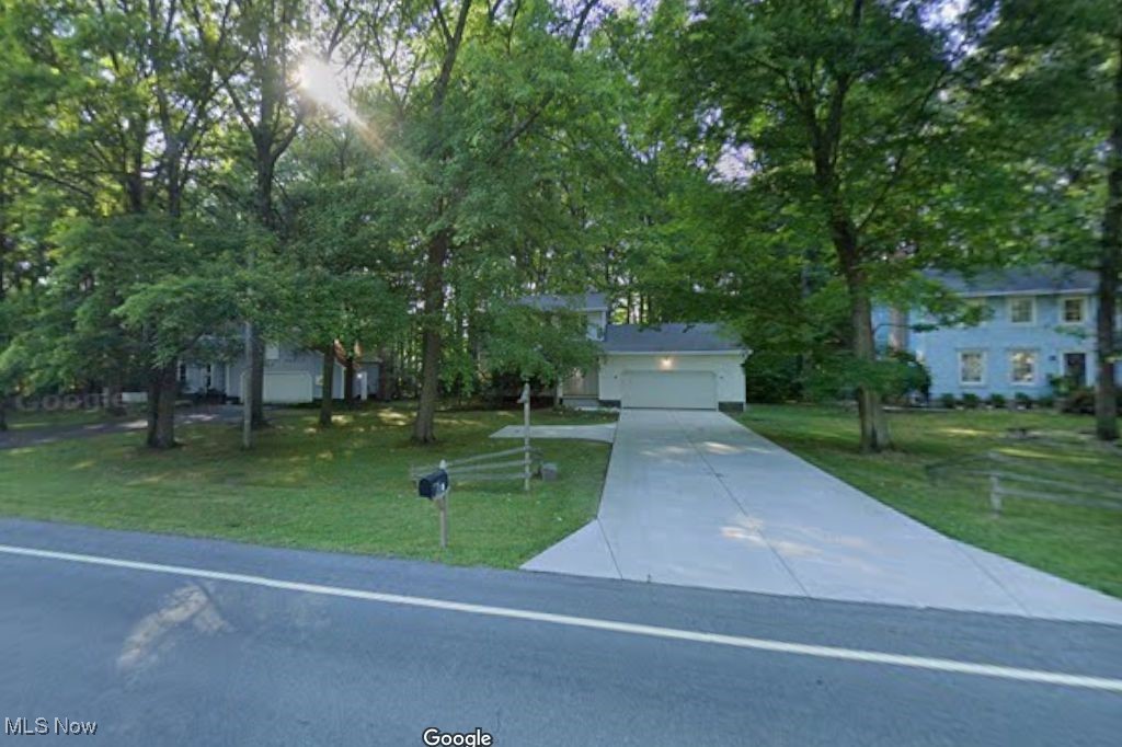 3 bedroom colonial, Family Room with gas fireplace and wood laminate flooring and opens onto a deck overlooking a wooded lot. Equipped kitchen with appliances. First floor laundry. Formal Dining Room and Living Room. 3 bedroom up and full family bath which also has access to Master Bedroom. Newer furnace and hot water tank. Cement drive with turn around.