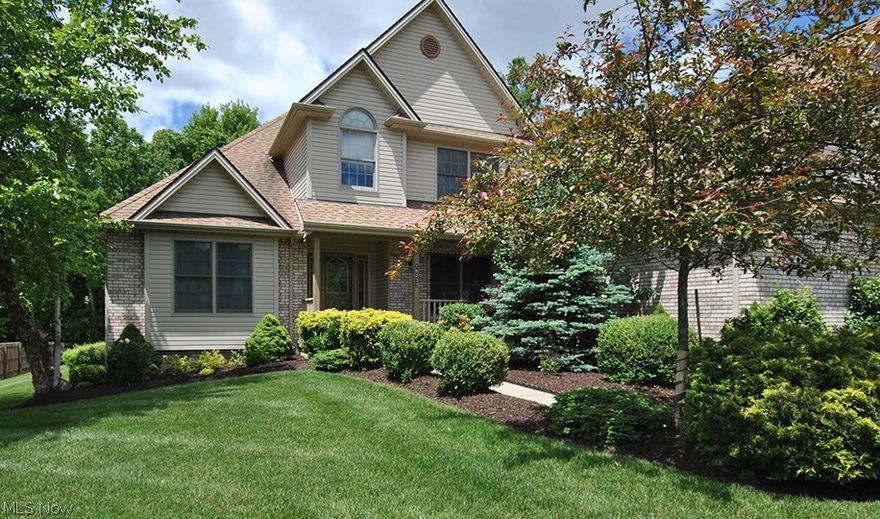 Stunning brick front, custom built home by Sherwood Homes w/front porch. One owner, true pride of ownership. May 2016 new stainless steel appliances in kitchen. Open floor plan, 2-story foyer w/custom staircase, wood floor. Spectacular 2-story great room w/custom fireplace. First floor office w/coffered ceiling and French doors, or could be living room. Formal dining room w/crown molding, wood floor. Fabulous kitchen w/custom cabinets, island, wood floor, all appliances remain. First floor master suite is beautiful w/coffered ceiling, 2 walk-in closets and glamour bathroom w/cathedral ceiling. First floor laundry room w/cabinets. 2nd Floor: 3 bedrooms, full bathroom, large walk-in attic area. Full basement w/roughed in bath. 3-car side load garage. Professionally landscaped, partially fenced area, custom deck. Private wooded peaceful setting. Prime location, walking distance to Metro Parks and golf course. Don't miss this fine home!