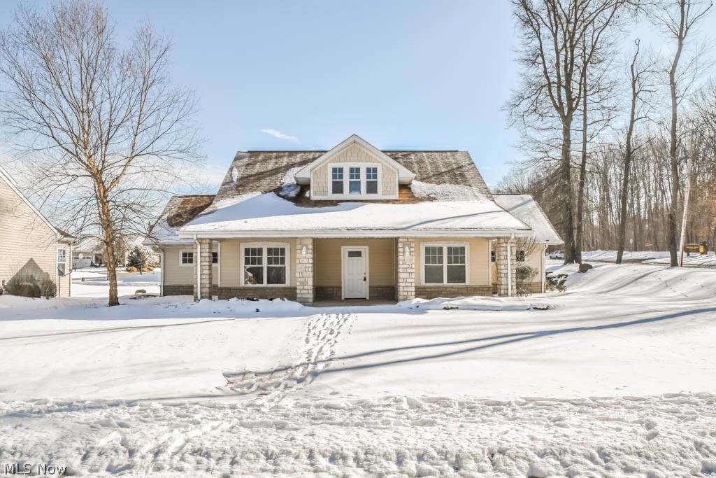 Don't miss this charming Cape Cod with inviting curb appeal! Inside, you'll find a desirable open floor plan featuring a crisp white kitchen with granite counters, subway tile backsplash and center island with counter seating. A coffered ceiling adds architectural detail to the great room with stone surround gas fireplace and dining area that overlooks the patio. The master suite offers a huge 10 x 11 walk in closet and spacious private bath with tub/shower combo. Bedroom #2 is generously sized and conveniently located near the 2nd full bath with tiled shower. The oversized laundry room with cabinets and counter space plus a dedicated storage room with exterior access are added bonuses. If you're looking for a fresh and modern home with true one floor living, you don't want to miss this one!