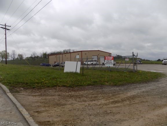 Industrial building on 8.6 acres in Fox Commerce Industrial Park. Place your business in St. Clairsville, OH, two miles from Interstate 70. Property is level with stoned yard for parking and equipment storage.