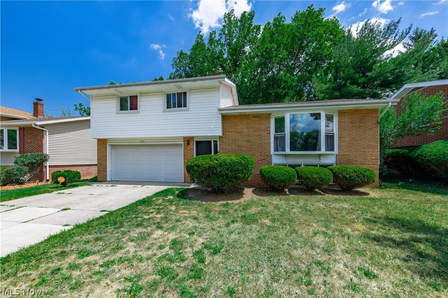 Welcome home to this spacious Split Level located on a desirable street in Garfield Heights.