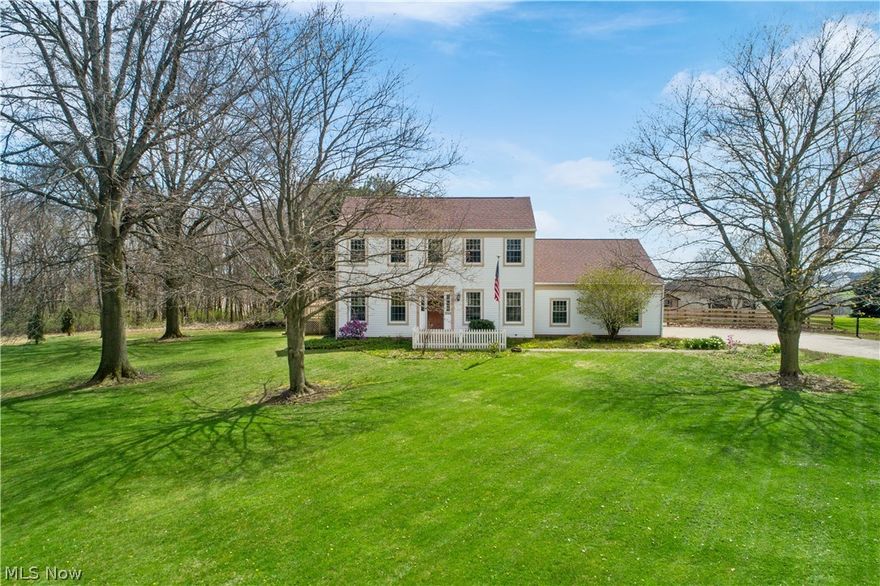 Welcome to this stately colonial situated on almost an acre, right on the edge of Orrville City! This charmer offers just over 3500 sq. ft. of finished living space. Inside, you're greeted with a private office and formal dining room, complete w/ hardwood floors & fresh paint.  Continue into the expansive eat-in kitchen/living room combo, where all appliances will remain. French doors lead to the 4 season room with vaulted ceilings and a fantastic 900 sq. ft. deck with beautiful views of the countryside below. You'll also find a half bathroom & laundry on the main level. The backyard is where your green thumb comes alive! Raised garden beds and potting shed are completely fenced in for all your gardening needs. Enjoy spending time in the recently remodeled master suite, complete with a large walk-in closet and master bath. Two large bedrooms w/ double closets and Jack & Jill bath round out the second level. Need more space, don't worry! Unfinished space above the garage is hiding behin