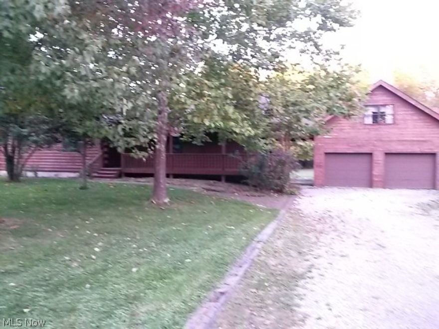 This exquisite log cabin style home located close to Mosquito Lake offers two bedrooms, two baths, large living room with fireplace and a wall of windows floor to ceiling, leading to large deck great for entertaining.  Master suite offers walkin closet, large soaking tub and shower.  Kitchen has great storage and counter for eating.  The loft overlooks the living room and would be a great hobby room.  Full basement can be used for additional living area.  Large two car garage with the second story available for man cave or storage.  Buyer will be responsible to tie into Trumbulll County Sewer, tap in fee is $1025, plus expense of excavating new line.