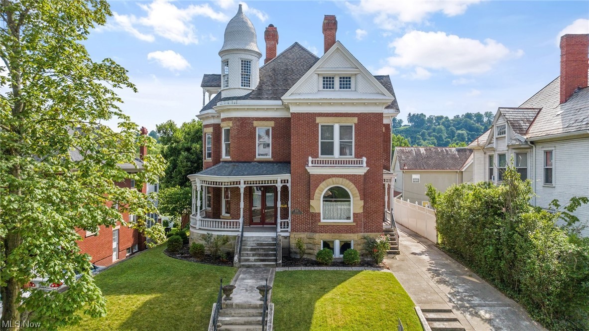 Urban 1892 Queen Anne is an exuberant display of Victorian architecture. Characterized by multiple stories, asymmetrical red brick facade, wrap around porch and third floor rounded tower. The well proportioned rooms are rich in artistic details and provide a nice circular flow ideal for entertaining and comfortable modern day city living. Architectural details include original inlaid flooring, bespoke woodworking, mantels, doors and staircase, period tiles and lighting fixtures. Custom kitchen with appliance package and butlers pantry. Careful restoration and current upgrades show equal appreciation for history and modernity. Private level back grounds, patio and off street parking. A list of appointments upon request. The protection of a home warranty.