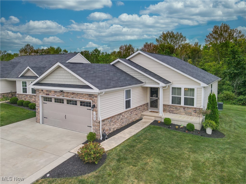 Welcome to this immaculate ranch home, built in 2018! As you enter through the front door, you'll be greeted by a charming foyer that leads to a dining room on the right, featuring elegant built-in cabinets. To the left, you'll find a convenient half bathroom and a cozy bedroom. Continue down the hallway to discover the open-concept kitchen and living room, designed for modern living. The kitchen features beautiful granite countertops, instant hot water at the kitchen sink, a stylish tile backsplash, and stainless steel appliances. The spacious living room features a built-in electric fireplace, creating a warm and inviting atmosphere. A sliding door leads you to the impressive Trex deck, which overlooks the serene backyard. Enjoy outdoor living with the added benefit of a retractable SunSetter shade that covers the deck. Adjacent to the living room and kitchen, a hallway leads to a convenient laundry room and the spacious main bedroom. The main bedroom featuring a large walk-in closet with custom organizers and a full bathroom with a walk-in shower. The lower level of this home is a fantastic space for entertainment and relaxation, featuring a large finished rec room with another built-in electric fireplace. This level also includes a full bathroom, a storage room, and an additional finished room currently used as a craft room. This home is absolutely gorgeous and offers a perfect blend of comfort and style. Don?t miss out on this exceptional opportunity! Call your agent today to schedule a private showing!