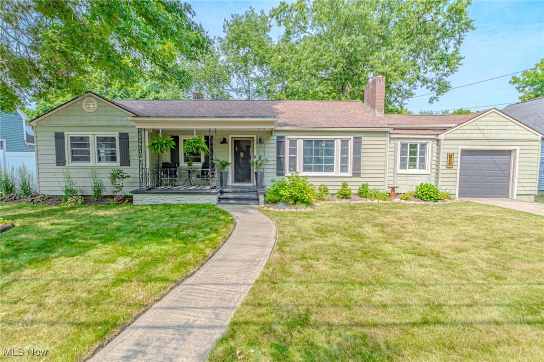 Welcome home to this move-in-ready home that features spacious living areas with refinished hardwood floors throughout, and a cozy, wood-burning fireplace. The kitchen offers maple cabinetry and Corian countertops, and all the appliances stay with the home, including the washer and dryer. The bright breezeway offers space to drop your things when you enter from the attached garage. The amazing basement, which has been fully refinished with paint and new flooring, has spaces for an office, entertaining guests, a home gym, or just lounging and has another fireplace, adding charm and ambiance. The beautiful backyard is a dream, featuring a vinyl fence that surrounds the yard, and a fantastic 17x18 deck for dining or relaxing with friends. The patio, and large storage barn/workshop elevate the outdoor experience of this lovely home. Major updates include roof, electrical panel, and sump pump. The exterior features vinyl siding and windows. A serene covered front porch adds loads of curb appeal. Don't wait to see this home!