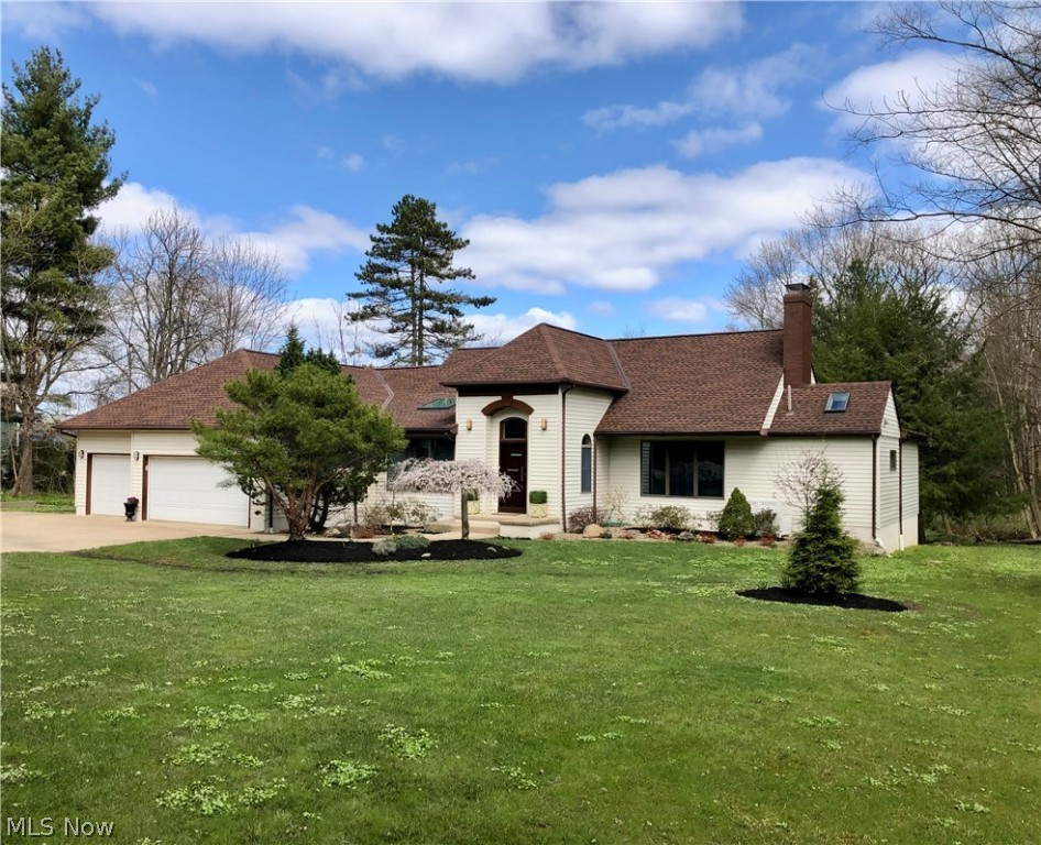 Stunning home set on private 2+acre wooded lot w/ stream. Updated throughout with newer kitchen and baths. Master on 1st and 2nd levels, Vaulted eat-in granite kitchen w/ island, stainless steel appliances, pantry & ceramic tile. Vaulted great room has a stone gas fireplace, dining area, abundant windows & natural light & walks out to a deck. 3 bedrooms and 3 full baths are on 1st floor. Upstairs has loft + huge bedroom and full bath. Walk-out lower level has rec room, 5th bedroom, full bath, full maple kitchen, laundry, & huge storage room. Covered patio overlooks backyard w/ fruit trees, meandering stream & cross the footbridge to find a swing in the woods. New: A/C, front door, covered patio, light fixtures, ext trim paint, landscaping ~1170 sq ft finished walkout LL kitchen has 2nd refrigerator, range, dishwasher, washer/dryer. Total of 5 bedrooms, 5 baths, 5 skylights, 3 fireplaces, 3 car garage~ New Septic 2017/Roof 2015
