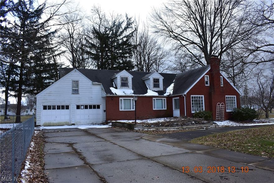 5 bedroom 2 full and 2 half baths situated on almost half an acre corner lot! Some Interior Features Include: Large kitchen with 3 walls of cabinets and counter tops, double ovens with brick surround, electric cook top, brick shelves, large dining room with box beamed ceiling, Huge living rooms with 3 5'x5' windows, wood burning fireplace, possible hardwood under living room carpet, foyer with coat closet and hardwood, Tons of storage and built in's throughout, office on first floor full of built in's, 2 dormers for natural light on the 2nd floor, Nice size bedrooms, some cedar lined cabinets, 2 stair cases, partial basement that is partially finished and more!! Exterior Features Include: 2 car attached garage 12x22 brick shed with greenhouse attached, part of the back yard is fenced in, mature trees, Stone landscaping, U shaped driveway and More!!! This house needs some updating/ TLC but mixes practicality with historic charm. Property is being Sold AS-IS.