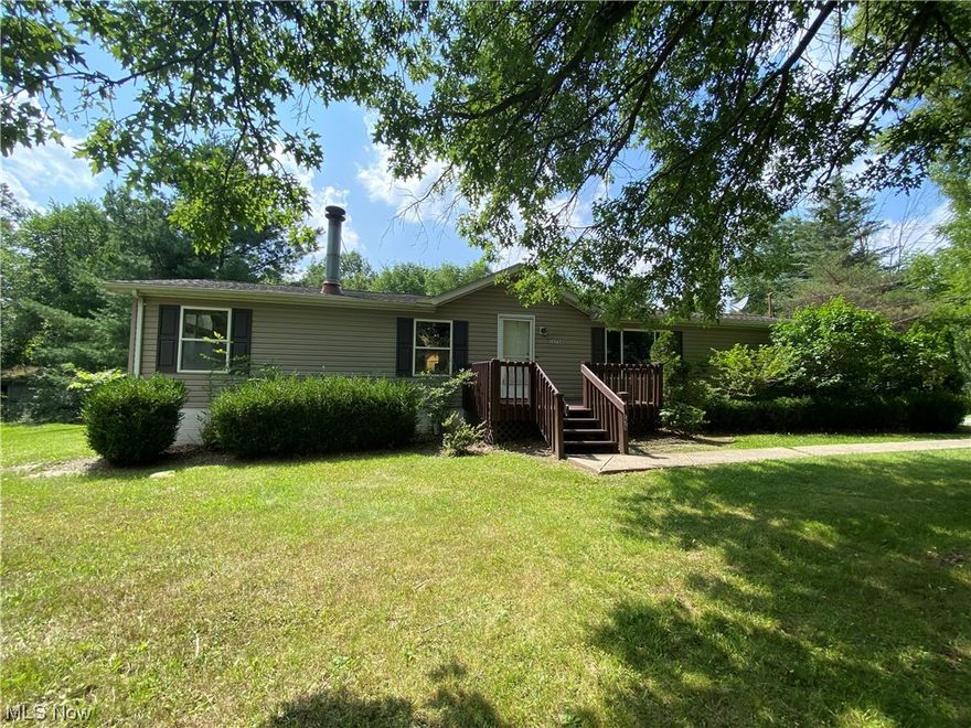 Built in 1998 and eager for your redecorating energy.  This home is ready for a new family to bring vision and invest sweat equity or an investor to add a great property with value add potential to a rental portfolio. Spacious, open concept single floor living with over 1700 sq feet of main floor living space.  Family room with wood burning fireplace opens to a large kitchen that walks out to a nice sized rear deck.  Formal living room leads to the bedroom wing offering a master bedroom with private ensuite bath, 2 bedrooms share 2nd full bath.  There is a large basement which can be finished for additional living space and a tall accessible crawl space to store all your bins of "stuff". Seller installed new water tank July 2023 and had it relocated from beside w/d down into the basement.  All appliances remain.  Washer/Dryer were purchased new in 2022.  Roof is believed to be approx 6 years old but not guaranteed.  Priced to reflect current condition.  Additional parcels 02-185750, 02-185751, 02-185752, 02-185753, 02-185755, 02-185756, 02-185757 included in purchase for a total of .54 acres which makes for a nice sized lot, larger than many in the neighborhood.  Less than 2 miles outside of the heart of Chagrin Falls. Shop, Dine, appreciate the falls. Many perennial shrubs and  plantings exist, such as rhododendron, lilac and boxwood and can be found along front, side and rear of property.  Square footage as per county auditor.  Selling "as is", seller to make no repairs.