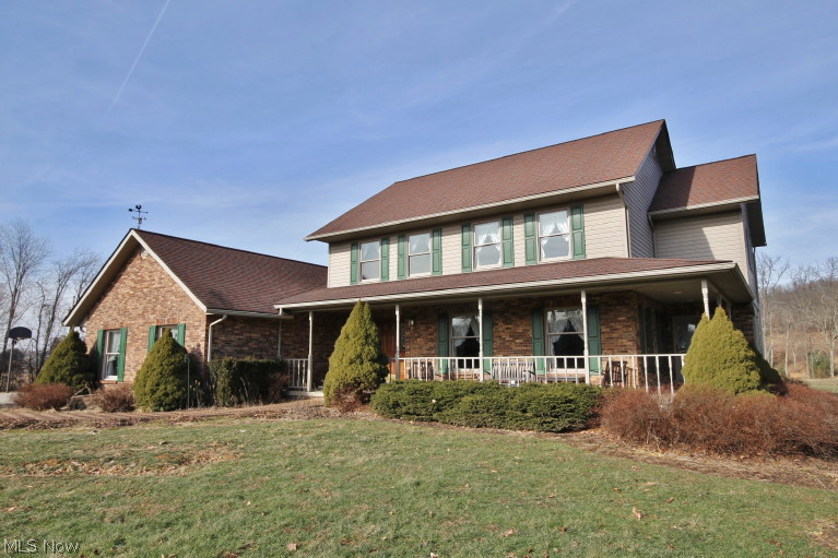 2-story brick and vinyl home with 2-car and detached 3-car offers to much to list! Sitting on 10 acres with over 2,700 sq. ft. of living space. The kitchen includes roll-out shelving, pull-out cutting board in its solid oak cabinets. With its open floor plan on the main level, the kitchen, breakfast nook, and family room feels like one big area. Add to the formal dinning room and living room that wraps around the other side! The second story offers four bedrooms, two full bath, and a surprise attic room to use as a play room work out room and more storage! Includes a full finished basement with potential 5th bedroom, bar and storage with exterior access. orchard with over twenty trees, fully stoked pond with private dock, geothermal heating, and large deck are bonus features.