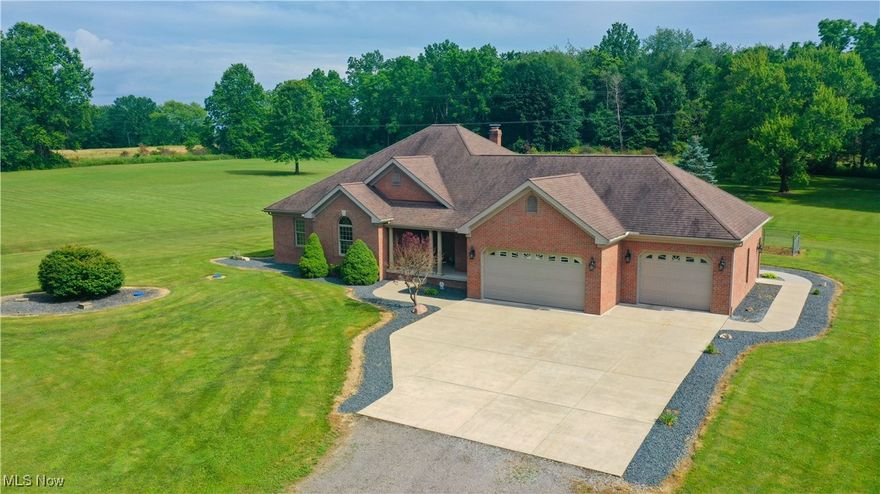 ATTENTION OUTDOOR LOVERS!! You can have your own PERSONAL WOODED RETREAT!! This CUSTOM BUILT BRICK RANCH is situated on OVER 25 ACRES with a 3,378 SF OUTBUILDING!! The AMAZING HOME features an OPEN FLOOR PLAN, spacious Living Room with WOOD BURNING FIREPLACE & French Doors leading to COVERED BACK PORCH; Kitchen with SOLID SURFACE COUNTERS, pantry, appliances & BREAKFAST BAR; Dining Room overlooking backyard with French Doors leading to CONCRETE PATIO; Entry Foyer with large closet & CUSTOM STAIRCASE to basement; FIRST FLOOR LAUNDRY ROOM with built in desk, bonus closet & utility sink; Master Bedroom with large WALK IN CLOSET & French Doors to covered back porch; Master Bathroom with Custom CERAMIC TILE SHOWER & Jacuzzi brand bathtub; Two Additional Bedrooms with large closets; Full Bathroom with standard bathtub; Full 13 COURSE BASEMENT with Wine Room or Fruit Cellar and ATTACHED THREE CAR GARAGE with hot/cold water & STAIRCASE TO BASEMENT. Additional home features include:  2' x 6' Construction, Oak Woodwork throughout from Baird Brothers, Pella Windows & Doors, Security System, Geothermal Heating and Generator. The OUTBUILDING has so many potential uses with a bar side for entertaining, garage side (approximately 1500 SF), extra outer garage, newer matching brick exterior, roof and windows. Also you will enjoy the benefits of the leased CELLULAR TOWER!! This is a ONCE IN A LIFETIME PROPERTY!! Call today to schedule your PRIVATE SHOWING!!