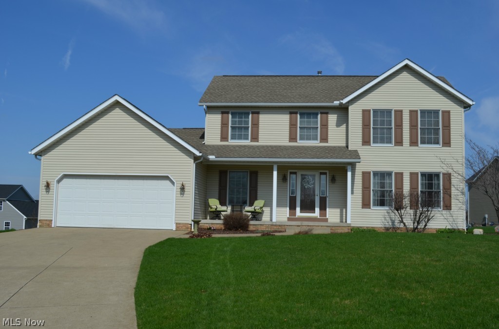 This great Perry home sits on a quiet cul-de-sac in an area of newer homes. Built in 1998, it has been lovingly cared for and nicely updated. The spacious kitchen has brand new stainless refrigerator and range and a breakfast bar. A gas fireplace is in the family room with new carpet and is open to the kitchen. Convenient first floor laundry room comes with washer and dryer. Newer wood laminate flooring run from the foyer to kitchen and formal dining room. A large formal living room, also with new carpet, provides a quiet place to unwind. The master bedroom fits all your furniture and has an attached bath with dual sinks, soaking tub, separate shower, linen closet and large walk in closet. All three bedrooms have ceiling fans and good closet space. Basement is nicely finished into a recreation room and a possible 4th bedroom. The unfinished portion has a work shop area and built in storage. Roof and siding new in 2008, hot water tank new in 2012. Low utility bills!