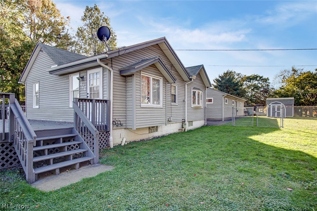 Many possibilities in this 1698 square foot ranch home! If you're looking for garage space/parking space, this could be just what you need. The huge garage features 2 parking spaces PLUS room for a workshop AND additional storage space! This unique lot, (.59 acres) goes all the way from Hilbish back to Lansing where you enter the parking/garage area. The two storage sheds are great for your outdoor equipment. There is a huge fenced-in area of the yard which is accessed from 3 of the exterior doors-perfect for letting your dogs out. Enjoy the large deck and patio areas for entertaining. The basement is clean and it's sprawling with plenty of room for more storage, a laundry area, full bathroom and a rec room complete with a bar area and a huge built in bench. The roof was replaced approximately 10 years ago, most windows have been replaced with vinyl, and if stairs aren't your thing, there is even an elevator to access the basement. The kitchen is in excellent condition and fe