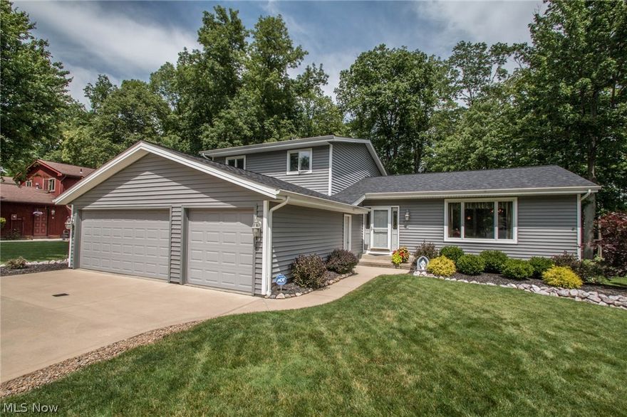 A WOW HOUSE!  This flexible foorplan can offer a 5 BR or a 4 with Den and even a 3 BR with dual offices on first and second by using smaller BR~So many options.  Fully updated and upgraded.  The heart of this home is the chefs kitchen with no detail overlooked.  Enjoy the SS appliances, handsome cherry cabinets, unique granite, double ovens, intricate tile, pull outs and so much more.  Open concept kitchen leads to family room with FP and more built ins and access to multi tiered deck and ample yard with privacy in rear.  If laundry rooms can be glamorous, this is one of them with seating, storage and granite with door to the RARE 3 CAR GARAGE.  The first floor is finished with a den/br.  All br can be found upstairs with ample master which has full bath and walk in closet.  Every bathroom has been remodeled as well.  The lower level has a family room, workshop and recreation area as well as ample storage.  Updates include*Roof*Gutters*Siding*Garage Doors*Driveway*Insulation*Furnace*AC