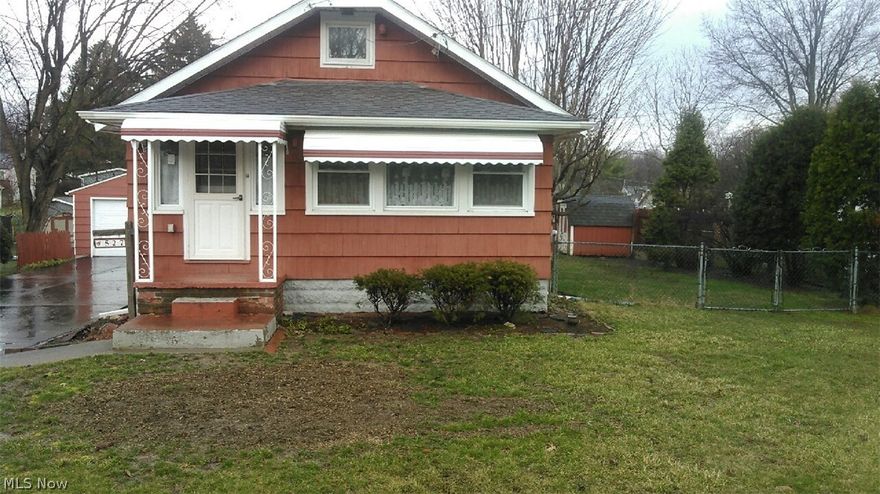 This charming home is ready for a family to move right in! Mud room off of rear entrance,  leads to newly painted kitchen with separate nook.  Arched doorways lead to spacious dining room and living room, both freshly painted.  1st floor bath has been beautifully updated with neutral tile. Newer windows throughout this home. When you walk in the front door, you are in a  finished room with much storage.  3 bedrooms on main level, one leads to a finished attic which can be used as an office, extra bedroom, or play area for kids. Full basement has a finished room, tons of storage, and newer glass block windows.  In the rear of the house, you will find a nice size fenced in yard with a shed and covered patio, great for entertaining, as well as a 2 car, oversized garage.  This house is priced to sell and a MUST see!