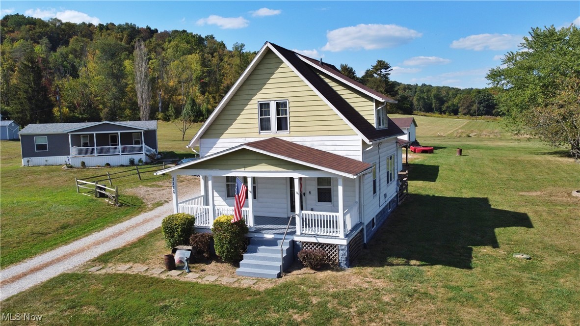 Welcome home to this charming 2-bedroom, 1-bath gem just minutes from Interstate 70 and Route 40, offering both convenience and country appeal. Enjoy the beautiful original woodwork that adds timeless character throughout the home. The spacious kitchen is ideal for cooking and gatherings, while the first-floor laundry room makes daily living a breeze. Relax on the inviting front porch, or head out back where 1.5 acres with a pasture await—perfect for farm animals, riding, or outdoor recreation.2 detached garages & carport make hobbies & storage a breeze. This property offers a perfect blend of comfort and functionality with plenty of room to make it your own.