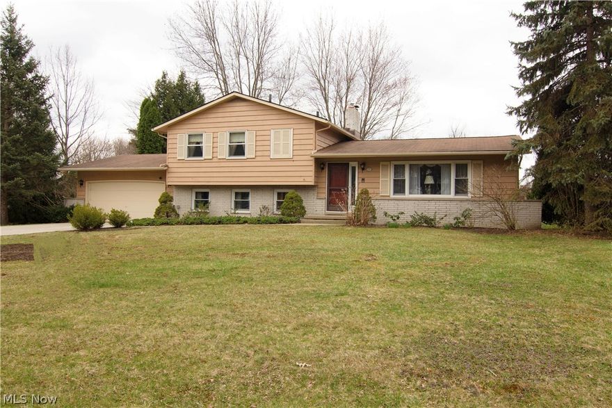 Exceptionally well maintained home, with recently updated kitchen, stainless dishwasher, all appliances remain; newer roof, guest bedroom off of family room with full bathroom; warm and cozy family room opens to a three seasons living area; beautiful views of back yard with grape vines and trees; backyard shed has concrete floor to house your garden equipment; two car garage with Nature Stone floor; hard woods through out; this home is ready for your personal touches to make it your own.