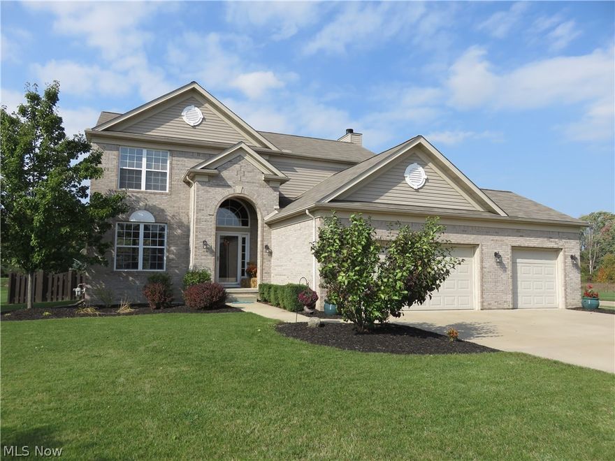 From first glance, this impressive 2-story stands apart from all the rest! The attractive brick exterior, extra-wide driveway, and 3-car garage make quite a statement, but step inside and be prepared to be totally smitten! Freshly decorated in today's colors, updated lighting, light fixtures, faucets, hardware throughout, this pristine home shows like a model! The inviting entry foyer gleams with rich hardwood floors, and is flanked by the light and airy living and dining rooms with newer carpet. Entertain in style in the fabulous family room with gorgeous wood-burning fireplace, and the pleasing open concept kitchen boasts an appealing layout, with loads of counter space and maple cabinetry, hardwood floors, a handy island, newer stainless appliances. Enjoy mealtime gatherings in the sunny morning room, offering great views of the rear yard. Vacation at home every day in your own amazing back yard oasis, boasting a gorgeous inground pool, a wonderful deck with pergola for shade, an oversized patio, privacy fence, even a firepit! The basement has been beautifully finished into a cozy rec room, wired for sound system, and is complete with a gorgeous bar! Upstairs, 4 spacious bedrooms, including a sumptuous owners' suite, vaulted ceilings, walk-in closet, an elegant glamour bath, featuring a large double bowl vanity, soaking tub, and recently upgraded tile shower. Stylish updated powder room, adjacent laundry, and hallway boast decorator tile flooring.