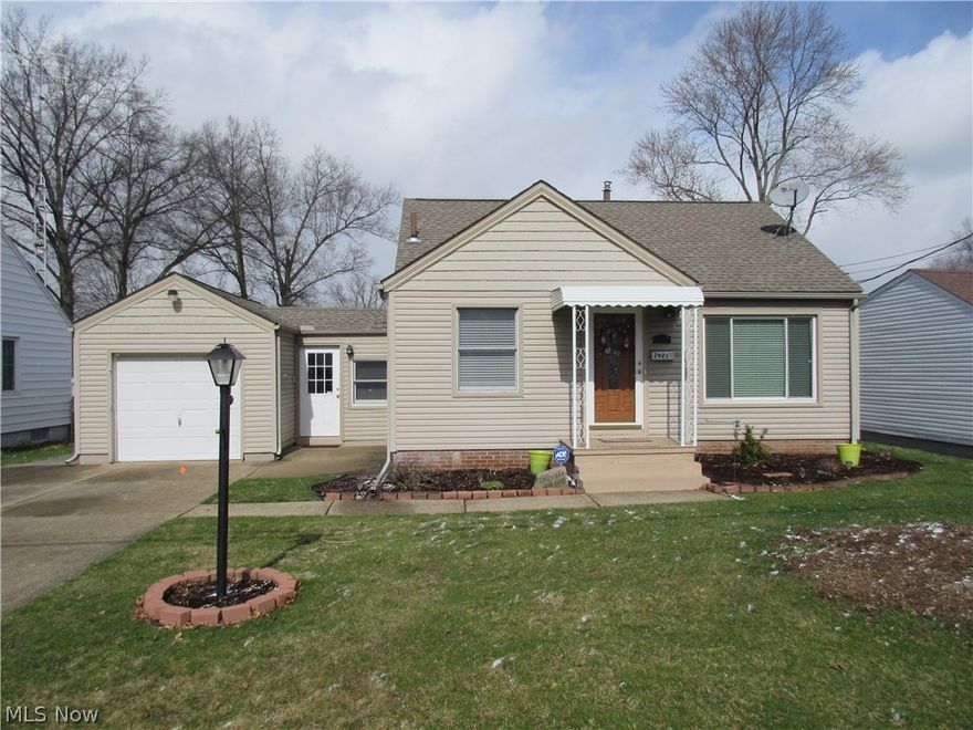 LARGER THAN IT LOOKS!  Pride of ownership is evident in this impeccably maintained 3 bedroom 2 bath home.  With over 1500 square feet of living space, the great floor plan features a large kitchen with oak cabinetry and newer stainless appliances, living room with stylish hardwood floors, 2 first floor bedrooms, a cozy enclosed breezeway, and a spectacular lower level with a huge rec room, wet bar, and full bath!  Situated on a double lot, this vinyl sided home allows for minimal outside maintenance.  Overlooking the spacious back yard is a 20x12 covered patio perfect for those summer days and nights!  Even the 14x10 storage shed is vinyl sided!  So much to offer including central air, professional landscaping, neutral decor and much more!  You'll want to call this house your home!