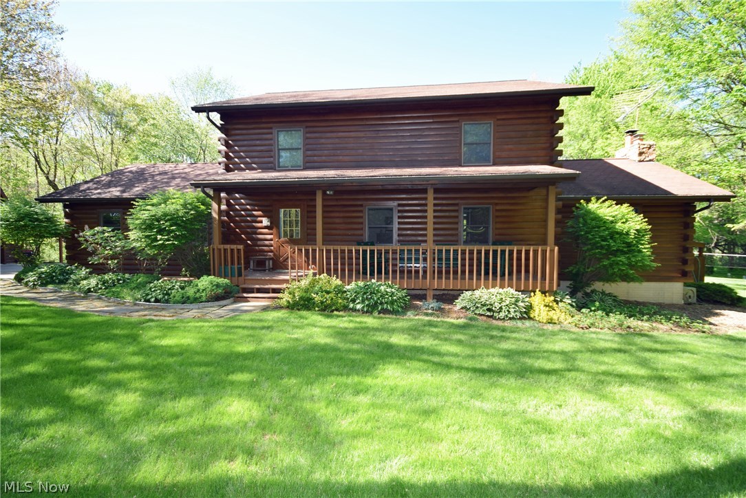 Charming log cabin style house on over 3 acres. 3 bedrooms, 2 full baths and 2 1/2 baths! Family room boasts vaulted ceilings with exposed beams, a wood burning fireplace and a sliding glass door that open to the deck. The large patio and in-ground pool make this space great for entertaining. Mater bedroom complete with a master bath and private deck overlooking the pool and backyard. Finished room in walkout basement with a wood burning stove. Private yard. 2 car attached and 2 car detached garage with workroom plus a lean-to. Updates: House, shop, deck, porch and fence stained in 2016, Water softener - 3 yrs old