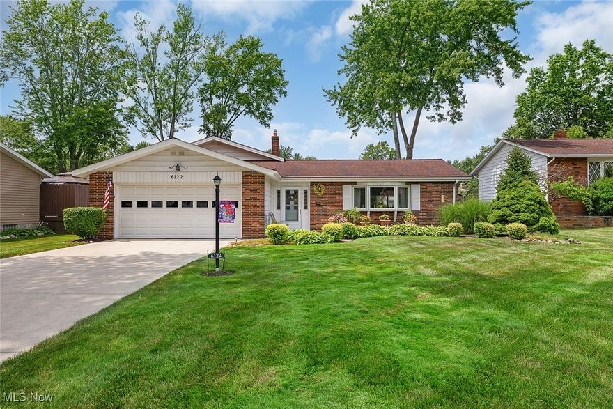 Wow! Coming home to 6122 Forest Ridge will make you very happy and proud! Your home boosts a newer driveway, windows, roof and gutters with Gutter Helmets (lifetime warranty) and a property that is gorgeously landscaped. You'll feel calm and safe to have a 2 car attached garage, with plenty of storage. A Large front concrete patio (12x11) welcomes your guests and is nice and shady place for a relaxing evening conversation. The backyard is beautifully manicured with easy care shrubs and annuals and is the perfect size for entertaining and family gatherings. A sliding door from the dining room gives you access to a colored concrete patio (21x11) and is partially covered, which is perfect for your morning coffee or tea. You'll appreciate the stainless steel appliances, granite countertops and refaced cabinets in the kitchen.  Under the carpeting in the living and dining room, in addition to the staircases and entire second floor you'll find oak hardwood flooring. The lower level has a versatile family room, half bath, pantry and large laundry/mechanical room, expanding the overall living space. The home has been meticulously cared for, so get your appointment scheduled today! This beauty won't last long!