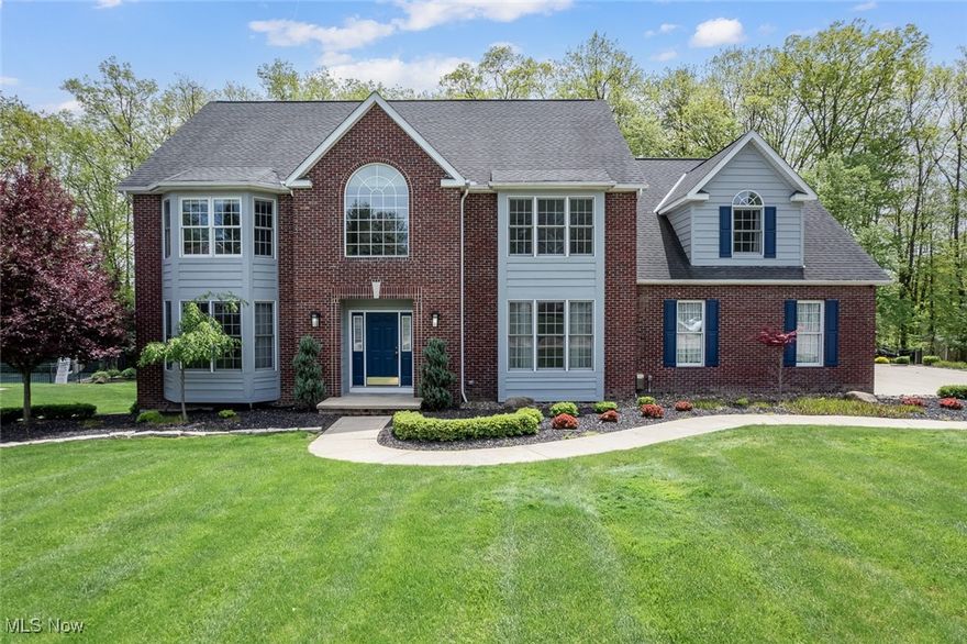 Welcome to 2901 Crystalwood Drive, a beautifully maintained 5-bedroom, 4.5-bath custom Colonial nestled on a half acre on a peaceful cul-de-sac street near the heart of Broadview Heights. This home offers a perfect blend of space and functionality; with access to community amenities including a pool, tennis courts, and basketball court. The main living spaces are bright and welcoming, enhanced by high ceilings and oversized rooms. A grand two-story foyer greets you and leads into a spacious dining room and a thoughtfully designed open floor plan, ideal for both everyday living and entertaining. The expansive eat-in kitchen features granite countertops, a large island, built-in desk, cherry cabinetry, included appliances, and a walk-in pantry.  A living room w/ French doors, 1/2 bath, office/flexroom, laundry room & large family room with cozy fireplace completes the main level. Upstairs you will find the sizable primary suite with vaulted ceiling, a walk-in closet, and en-suite bath. 4 additional bedrooms are all generously sized and are served by 2 bathrooms, offering comfort and privacy for family or guests. The finished walk-out basement is a true bonus, complete with a second kitchen and full bath; perfect for entertaining, a guest suite, or multi-generational living. Storage is abundant throughout the home, with walk-in closets and built-in organization. Recent updates include a new deck in 2018, patio 2021, HVAC system in 2019, a fenced backyard added in 2020, and fresh interior paint in 2025, new plush carpet in multiple rooms including basement. The roof was replaced in 2013. Lush landscaping surrounds the property, and the private treed view offers a peaceful backdrop. The oversized, 3 car garage adds practicality and space for hobbies or storage. With its ideal location, impressive updates, and spacious layout, this home is a must-see in Broadview Heights.