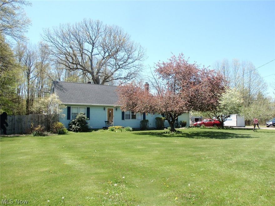 Little bit country - 2.37 acre lot - partially wooded and beautiful setting with mature trees and landscaping.  Large living room has laminate flooring, ceramic tile in the entry and coat closet.  The kitchen, dining area and hallway have new vinyl flooring.  Abundance of maple cupboards and counter space in the kitchen which overlooks the backyard.  Nice coffee bar in the dining area that has patio door to rear enclosed porch.  2 Bedrooms on the first floor and beautiful updated full bath with ceramic tile flooring and granite countertop. Smallest bedroom on first floor was being used as an office.   Second floor has 2 generous sized bedrooms and full bath which also has ceramic tile floor. Ceiling fans in most rooms.   Tons of closet and storage space.  Rec Room in basement is 21 x 12 and has wood burning stove. Enclosed Sun room and rear deck with covered area for cooking plus 14' round aboveground pool and all equipment included with sale. 2 car attached garage and enough storage for 4 more in the Amish built, steel outbuilding 40x30 with 2 overhead doors 8'.   Additional Storage shed is 16x12.  Roof is 6 years old.  Excluded from sale are:  generator,  storage cabinets in garage and outbuilding.  Assessment of $446.46 for sanitary sewer has been added to tax figure.