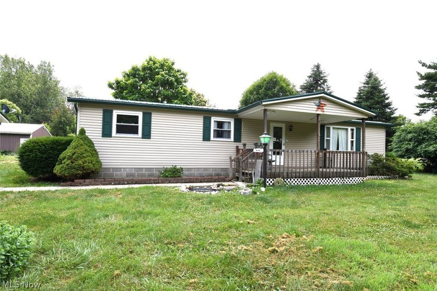 Unique property!  Beautiful Setting with over 5 acres total
Manufactured Mobile home sits on one parcel with 3.03 acres Home is in good shape with 3 bedroom, 1.5 bath includes sunroom added in 1996
Property has oversized 2 car detached garage and couple of outbuildings 
Second parcel has block building (previously flint museum) and sits on 2.27 acre along with shelter house