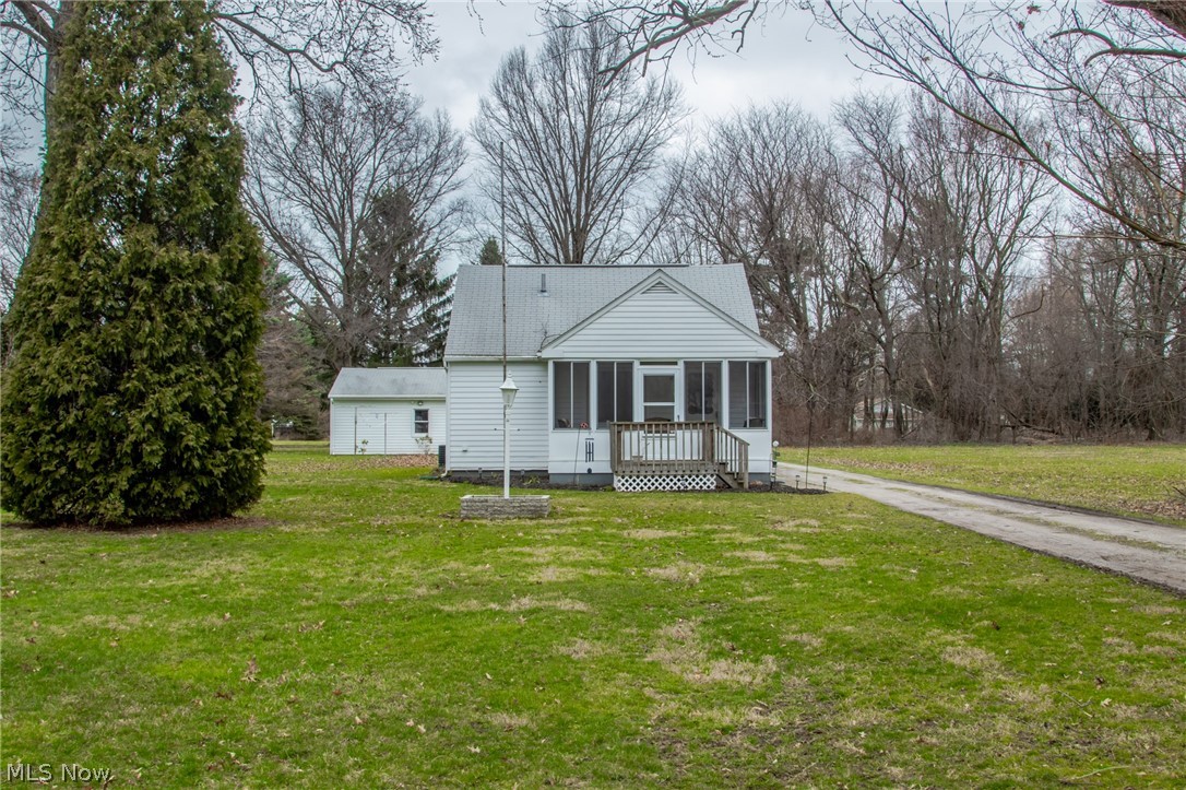 This adorable home sits on almost a full acre in Perry township. The flag lot offers much room for entertaining with campfires and play!
It is set back from the main road to offer privacy. The home has had some updates with paint and flooring, kitchen and bath from 2016-2017 and have been meticulously maintained since! The large utility room offers plenty of space for storage and also acts as a mudroom. The front porch will give you a nice place to relax and enjoy the upcoming spring weather. The back porch will be a great place to gather with friends. There is a large 2 car detached garage with plenty of room for hobbies. in addition, there is a shed to house all the garden tools. You are very central in location to shopping, dining and the freeway. This cozy home will make you feel "right at home!"