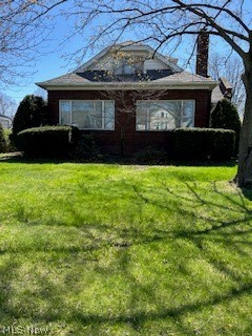 Bring your finishing touches to this wonderful and spacious brick, five bedroom, cape cod home, ideally located, with views of the lake. Raise your family or an investors special. Beautiful hardwood floors throughout the home. Full basement with a side entrance to the basement. 3 lots total. Enclosed side porch. Full and half bath on first floor, and a full bath on the second floor. All bathrooms need your special touches and updated. Some ceiling repair work is required on first and second floor. Bring your imagination, and bring this home back to the gem it once was.