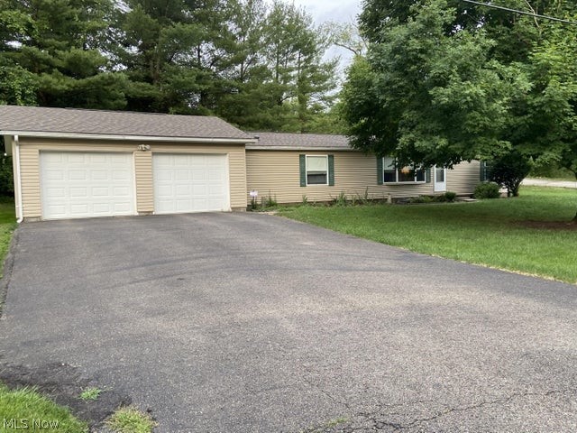 WOW! You have to see this home on almost 1/2 acre! 3 bedroom + large den/office and 2 full bathrooms. Vaulted ceilings and easy one-floor living with a terrific floor plan, a 2 car attached garage and a fenced back yard with an 8'x12' shed. Kitchen includes a breakfast nook, currently used as a seating area, and home also includes a dining room in the open floor plan. New roof, new siding, new AC, new furnace, new flooring throughout, and MORE. Agents, see documents section for a list of improvements; all major expenses have been done!