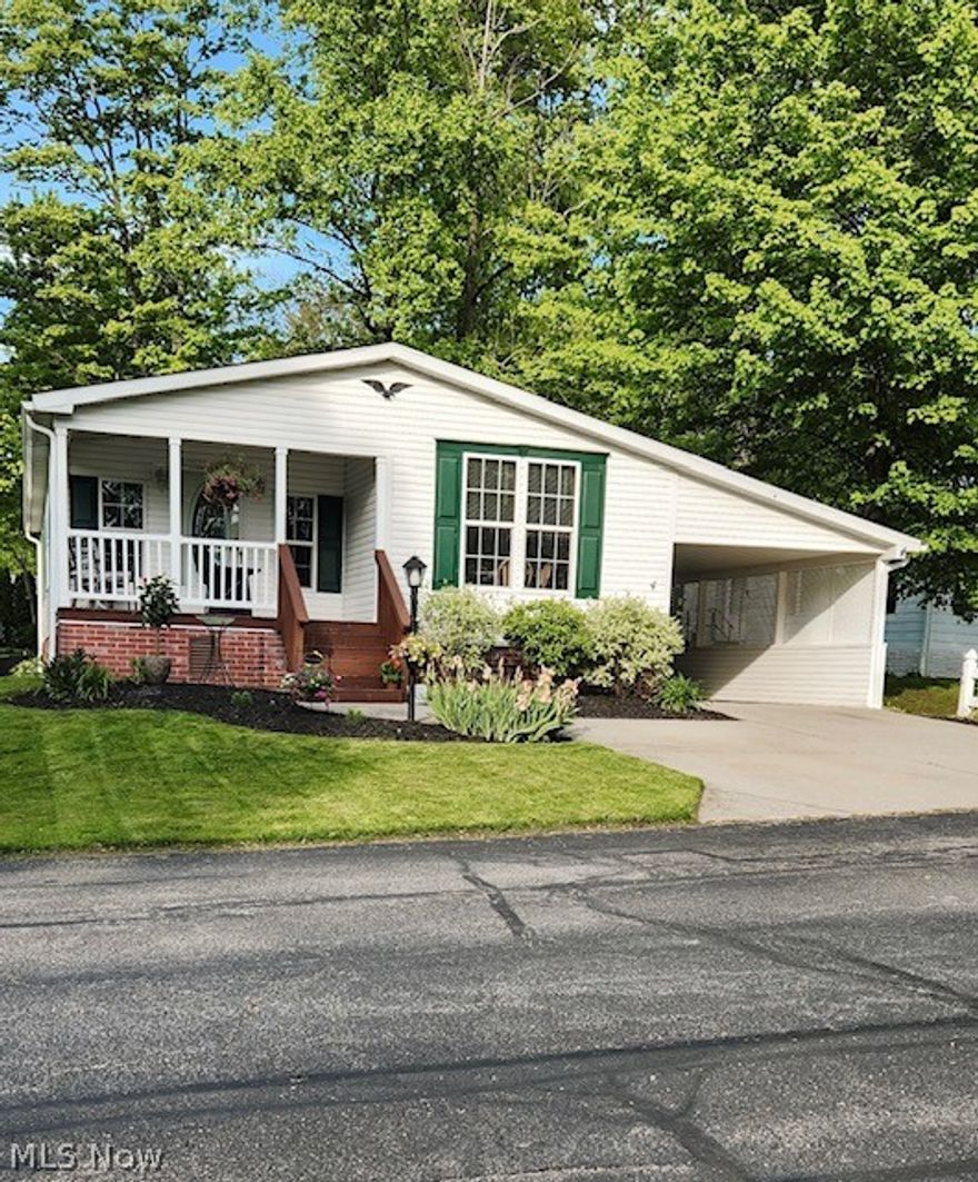 Welcome to 4 Cardinal Dr, nestled in the heart of the charming Troy Oaks development in Hiram, OH. This beautifully maintained 3-bedroom, 2-full bath manufactured home is one of the newest gems in the community and offers a delightful blend of comfort and convenience. Step inside and be greeted by a spacious living area that flows seamlessly into a modern kitchen equipped with all appliances, making meal prep and entertaining a breeze. The master bedroom is a true retreat, featuring a private bath and a generous walk-in closet, providing ample storage and a touch of luxury. Two additional bedrooms are perfect for family, guests, or even a home office, each with plenty of space to personalize. You'll love the convenience of having another walk-in closet, ensuring that storage is never an issue. The home is set on a sturdy slab foundation and offers two additional storage areas: one in the carport area and another at the back of the home. Whether you need space for tools, outdoor gear, or seasonal items, you'll find plenty of room to keep everything organized. Step outside onto your private deck, a perfect spot for morning coffee or evening relaxation. The large shed in the backyard provides even more storage, making it easy to maintain a tidy and clutter-free living space. One of the highlights of this home is its prime location in a great, friendly neighborhood. You'll enjoy the peace and tranquility of the area, as well as the short walk to the serene Lake Ladue, perfect for nature walks, fishing, or simply unwinding by the water. This home is move-in ready with all appliances staying, so you can settle in and start enjoying your new lifestyle from day one. Don't miss this opportunity to become part of the welcoming Troy Oaks community at 4 Cardinal Dr. Schedule a visit today and see for yourself why this home is the perfect place to create lasting memories.