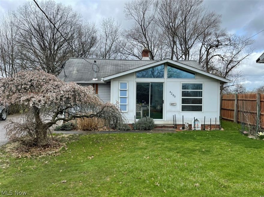 Rare find in Cleveland .37 acre lot. Updates include new AC last year, new 2 car garage with electric and man door 6 years young, newer vinyl siding (house and garage), newer triple pane windows (all but two, they are double pane). Enter the side door to the eat in kitchen with laminate floors and stainless appliances. The dining room is the perfect place to gather for meals, game night etc. To the left you step down to the two, tandem bedrooms at the back of the home. At the front of the home you'll find a family room with a raised ceiling and a full bath. Relax on the enclosed porch and enjoy the flowering bushes that bloom every year. The basement offers plenty of storage and a laundry area. The shared driveway leads to a large parking area and a newer built 2 car garage with man door for your car, lawn equipment etc. The rare large yard is the perfect place for play, a garden, pets etc. If you are tired of renting and want to start building equity, this is your chance!