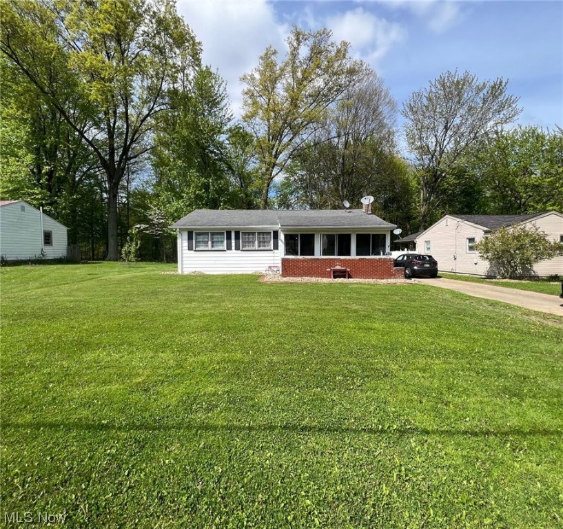 Welcome to this charming 3-bedroom, 2-bathroom ranch located in the highly sought-after Boardman Schools! As you approach the front door, you'll first notice the delightful enclosed front porch that provides an additional space to relax & enjoy the fresh air. The functional & practical layout of this home is perfect for families or those who love to entertain. The spacious Living Room flows seamlessly into the Dining area & Kitchen with newer appliances, making it easy to host gatherings of any size. And when you want to take the party outside, the detached garage with a covered patio area is the perfect spot to enjoy the fresh air & enjoy the serene backyard. The main living areas boast newer LVT flooring, providing both durability & a modern aesthetic. The hardwood flooring in the bedrooms adds an elegant touch & creates a warm & inviting atmosphere. Additionally, you'll find a partially finished lower level, offering the perfect opportunity for your personal touch & customization.
