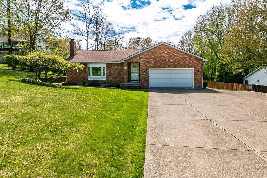 Stunning Brick Ranch nestled on 1.79 acres. The next long driveway with turn around is a huge plus! 3 bedroom and  2 gorgeous full baths. Walk into the foyer and the step down great room with vaulted ceilings and beautiful brick gas fireplace awaits you with a custom wood mantel. The extra large windows let in so much natural light. The grand kitchen had custom hickory cabinets and Corian countertops and extra wide deep sink.   The views from the dining room are stunning!  Walk out the glass sliding door onto the deck and enjoy the views of your serine park like setting.  You will feel like you are at a park. Master suite is perfect and other two bedrooms are great sized.  Finished basement is wonderful and there is tons of storage down there too! There is nothing to do but move right in! So many custom upgrades are throughout this home.  Best news of all....  NO HOA!!!