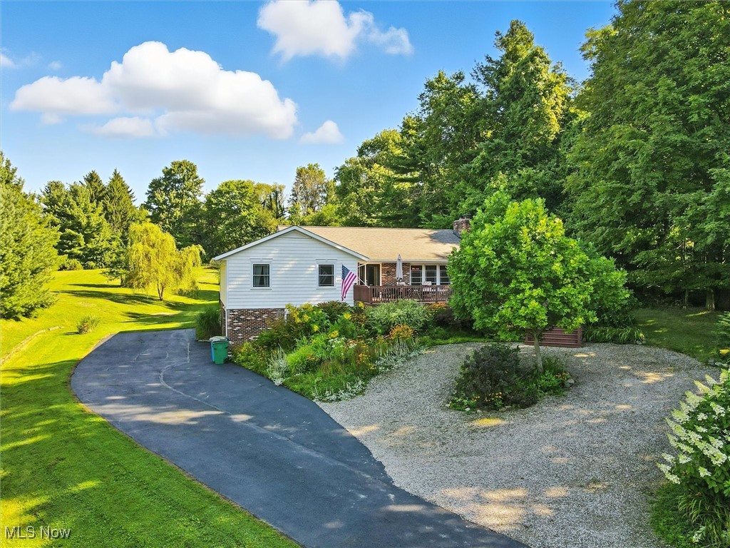 Welcome to this inviting 3 bedroom, 2 bath raised ranch situated on 1.56 acres. This home features a beautifully remodeled kitchen with Maple cabinetry from Choice Cabinets, solid surface countertops, and plenty of storage and workspace. Additional updates include a tankless hot water heater, central air, gas furnace, new doors, and a wood-burning fireplace that adds warmth and charm.
The home offers a large primary bedroom with an en suite bath, along with two additional spacious bedrooms providing comfort and flexibility.
Step outside to a serene deck overlooking the thoughtfully landscaped grounds and partially fenced yard, offering both relaxation and convenience. The septic system is current with Geauga County requirements, with the permit paid and valid through this year. A snow blower is included for added ease.
This property has been professionally cleaned and is move-in ready. Enjoy the peaceful surroundings and the natural beauty of the local wildlife, including turkeys, deer, and a variety of bird species. Truly a wonderful place to call home!