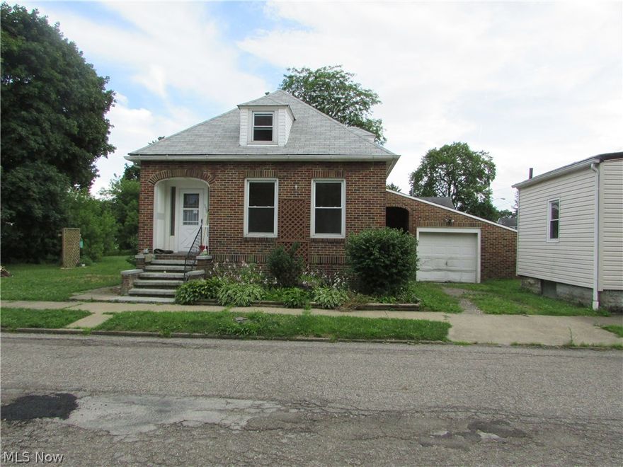 Two houses on one parcel.  Front (small house) rents for $300.  Live in or rent out the all brick, 4 bed cape with attached garage.  The home has a large kitchen, first floor bed and bath, a full basement, and more.