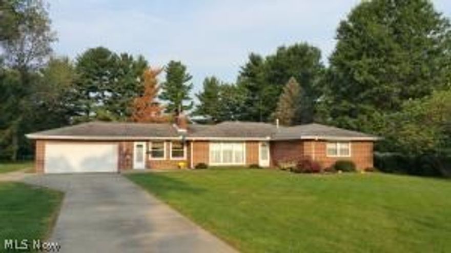 Enjoy the new carpet and flooring in the living room, dining room, kitchen, and family room of this 3 bedroom brick ranch on cul-de-sac in Newark's north end. Two full bathrooms. Master bedroom has private full bathroom. Large family room with wood burning stove. Big kitchen with appliances included. Dining room, and large living room with wood burning fireplace. Covered patio in back with partially fenced yard and storage shed. Lot size is 156 x 248 (.67 acres.) Two-car attached garage. Home Warranty plan included.