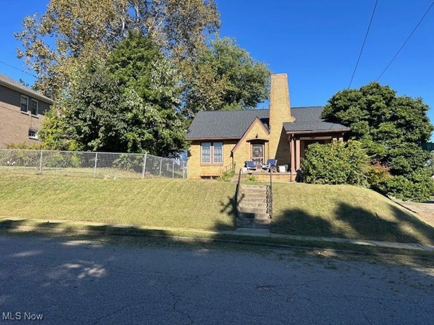 Brick cottage located on the corner of Wheeling Ave. and Newman St., offering both on-street parking and private parking on the property. This home includes an additional lot providing extra outdoor space for gardening, recreation, or other uses.

The main floor features 2 bedrooms and 1 full bath, with an additional upper-level bonus room suitable for a possible 3rd bedroom, office, or loft. Original woodwork is present throughout the home, and cedar-lined closets provide added storage. A basement-level garage offers convenient access and functionality. The yard is partially fenced, creating a defined outdoor area with flexibility for multiple uses.

Conveniently located near local amenities and major routes, this property combines character and practical features in a central Zanesville location.
