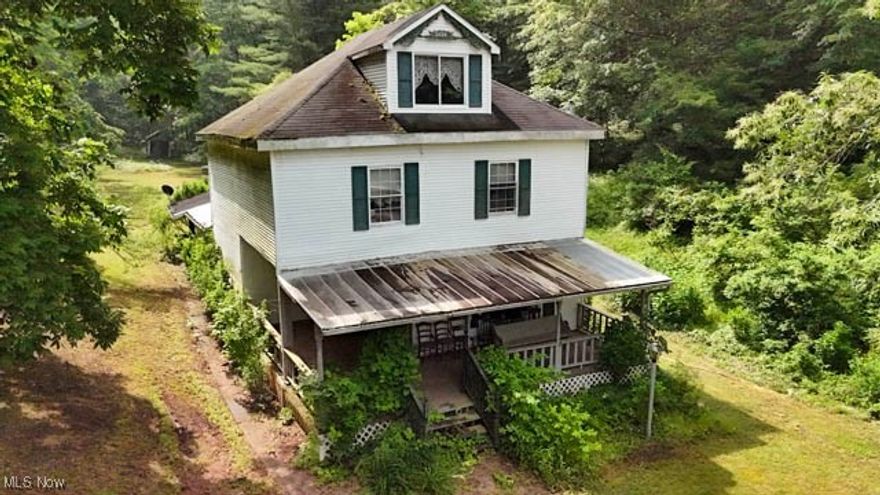Step back in time with this secluded 39-acre property in Washington County, Ohio. Featuring the original old farmhouse, this historic homestead is ready for renovation and offers a rare opportunity to create your dream retreat. The land itself is a showstopper—with open fields, a large stocked pond, creek, and wooded areas ideal for exploring or hunting. A perfect spot for camping, recreation, or building your dream home or if you’re ready for a project; let your creativity run wild and breathe new life into the historic farmhouse. The property includes a garage, outbuildings, and an old rustic cabin that adds charm and potential. Surrounded by nature and bordering hundreds of acres of Wayne National Forest, you’ll enjoy unmatched privacy and peacefulness. Mineral rights will convey. Opportunities like this don’t come around often—come explore the possibilities and experience the quiet beauty this property has to offer.