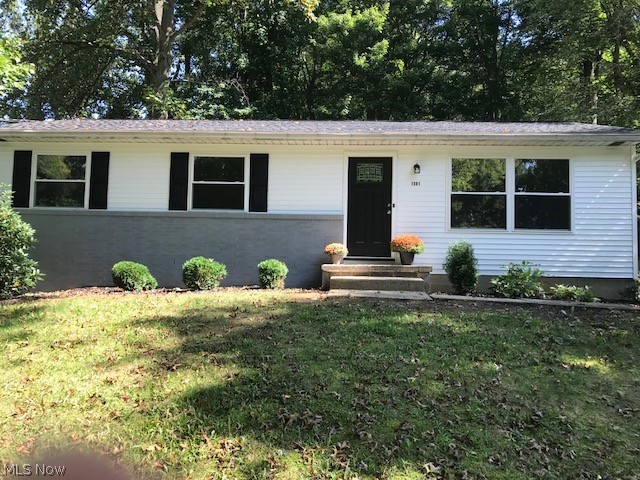 BACK ON Market! This is the home you want if you want a place that was completely remodeled in 2018! Pack your bags and get here quickly! Across the street from a nice fishing lake in Stow, this beauty has been brought back to nearly new status with today's gray and neutral color palette! New roof, new siding, new windows, new doors, new kitchen (with luxury vinyl laminate flooring)with new fridge and disposal, new bathroom (with marble vanity and tile surround), new floors, new light fixtures, new deck, and so much more! Situated on a large lot, with almost a half acre of trees, this is the perfect lot for someone who wants a large yard for pets or privacy, yet not a lot of grass to mow and maintain! The basement is a large awesome space that would be a wonderful footprint for additional finished rooms! Surrounded by higher priced homes, this beauty was priced perfectly for someone who wants to "buy right"!!! Come see it today!