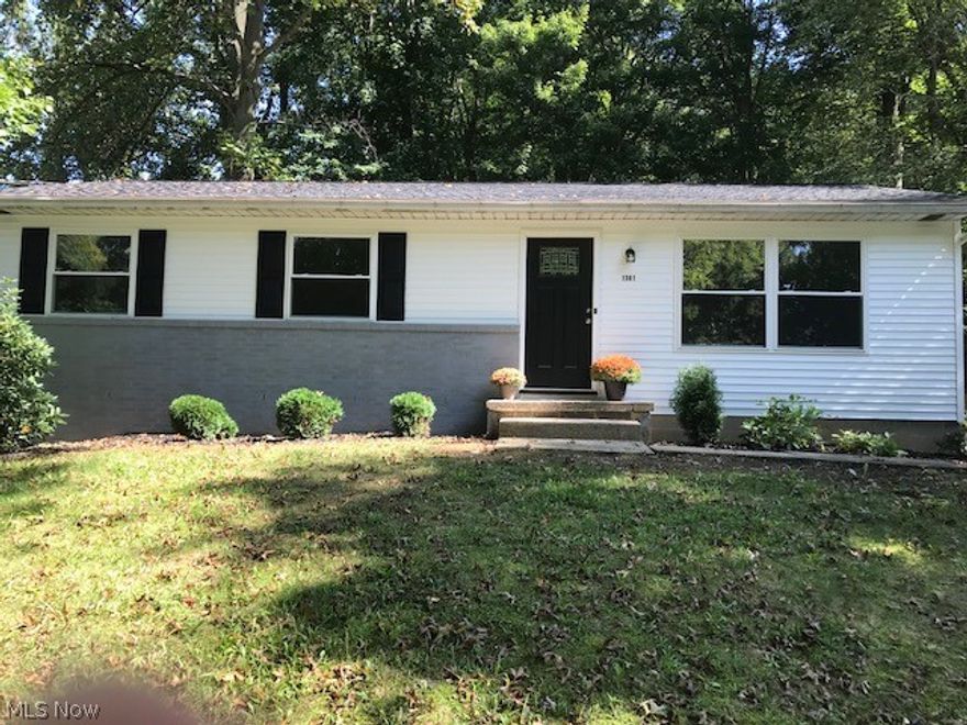 BACK ON Market!  This is the home you want if you want a place that was completely remodeled in 2018!  Pack your bags and get here quickly! Across the street from a nice fishing lake in Stow, this beauty has been brought back to nearly new status with today's gray and neutral color palette!  New roof, new siding, new windows, new doors, new kitchen (with luxury vinyl laminate flooring)with new fridge and disposal, new bathroom (with marble vanity and tile surround), new floors, new light fixtures, new deck, and so much more!  Situated on a large lot, with almost a half acre of trees, this is the perfect lot for someone who wants a large yard for pets or privacy, yet not a lot of grass to mow and maintain!  The basement is a large awesome space that would be a wonderful footprint for additional finished rooms!   Surrounded by higher priced homes, this beauty was priced perfectly for someone who wants to "buy right"!!!  Come see it today!