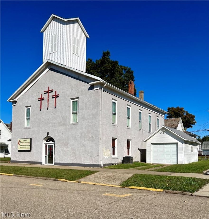 This beautiful church was built in the late 1800's and has been in operation until the spring of 2022! Located on a corner lot, in the heart of McConnelsville, this unique, one of a kind building could be used for other businesses such as a day care facility, an office, retail space and more! There are many possibilities if you're trying to think outside the box! There are 2 restrooms, a kitchen, several office/storage rooms, the large gathering room on the main floor and the congregation upstairs. (The pews do not convey.) The original wood work throughout is breathtaking! It was been well maintained over the years. There are 2 furnaces and one HVAC unit that cools the upstairs. The chair lift will remain and has been recently inspected and approved. There is a 1 car garage also included! Call today for more information on this rare find!