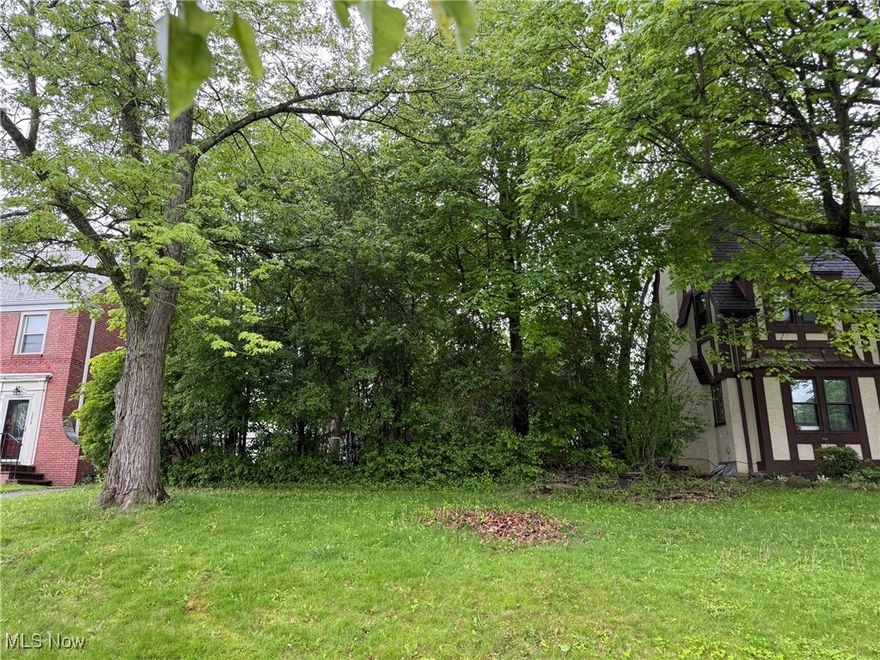 Rare find--a buildable lot in University Heights, Ohio! As an added bonus, at the rear of the lot sits a lovely brick garden house, fitted with electrical wiring. Bring your builder or ask us about a 1700 sq ft, 3 bed/2.5 bath colonial that can be built here for about $450k. Wonderful location, easily accessible to Downtown Cleveland, University Circle, and just minutes to freeway access and public transportation. Enjoy the best of both worlds, city amenities without traffic jams and long drives AND a tree-lined street of lovely old homes that is still amazingly quiet and secluded. Just a block from great stores like Macy’s, Target, Whole Foods, Starbuck’s and an assortment of neighborhood eateries (including local favorite Geraci's)--there's even a beautiful, old city library! Gas, electric, water, and sewer are all available for this Washington Blvd gem.