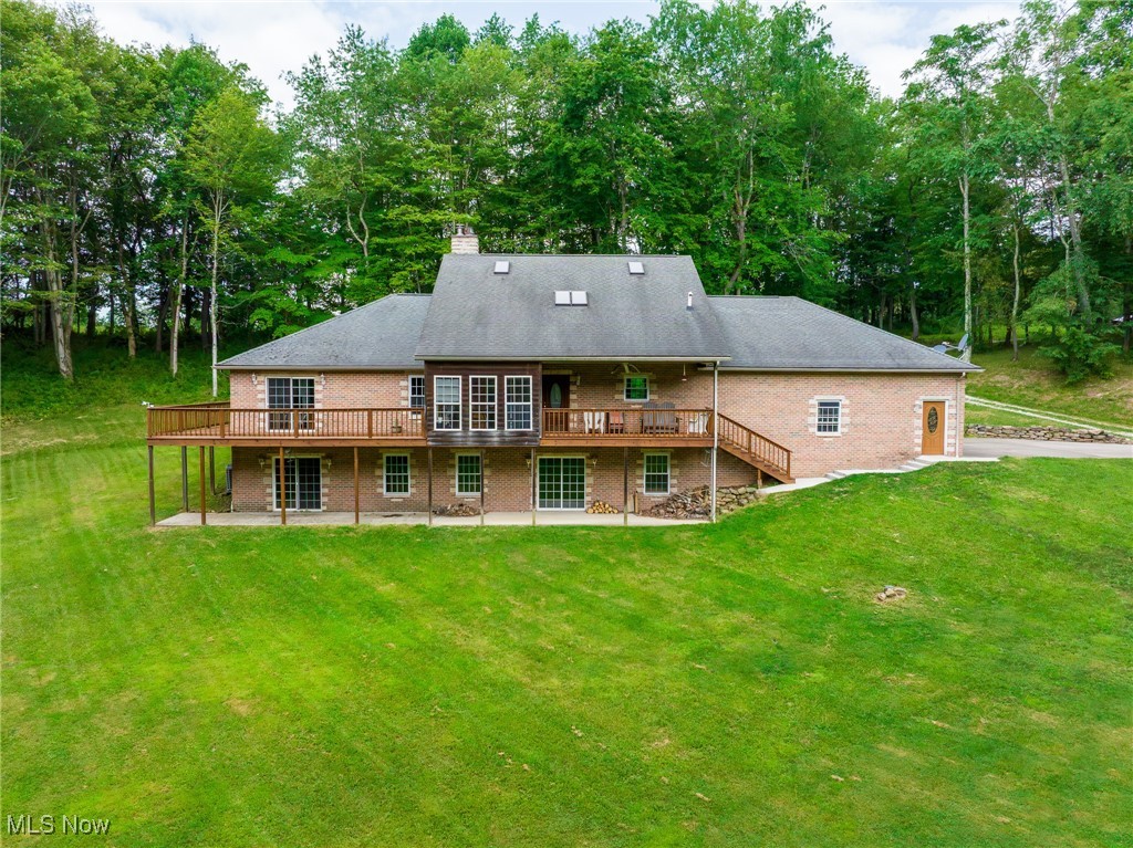 On-site auction Tuesday, September 16th at 6:00 PM. Country living at its finest, an amazing 5 BR, 4.5 Bathroom home that could be your dream home. Located just a few miles south and east of Newcomerstown, this home features a large walk-in kitchen, dining room along with a master bedroom and an attached patio with access from the bedroom. A nice sunroom is perfect for that morning coffee. Upstairs there are several bedrooms and a full bathroom. Downstairs you will find a kitchen, A large family entertainment room area, 2 bedrooms and a bathroom along with a large fireplace. Here you have a walk out basement leading to a nice porch and into the backyard. This property has propane forced air heat and central air. A nice 2 car attached garage leads into the kitchen area. Outside you have a garage/ horse barn with electric. The land parcel is a beautiful building lot along with a nice, wooded area for hunting. Any minerals owned by the seller will be transferred to the buyer. Do your own research on the status of mineral rights. The property is being surveyed by Emler surveying, and should it be sold in 2 parcels it will be surveyed to determine final acreage.