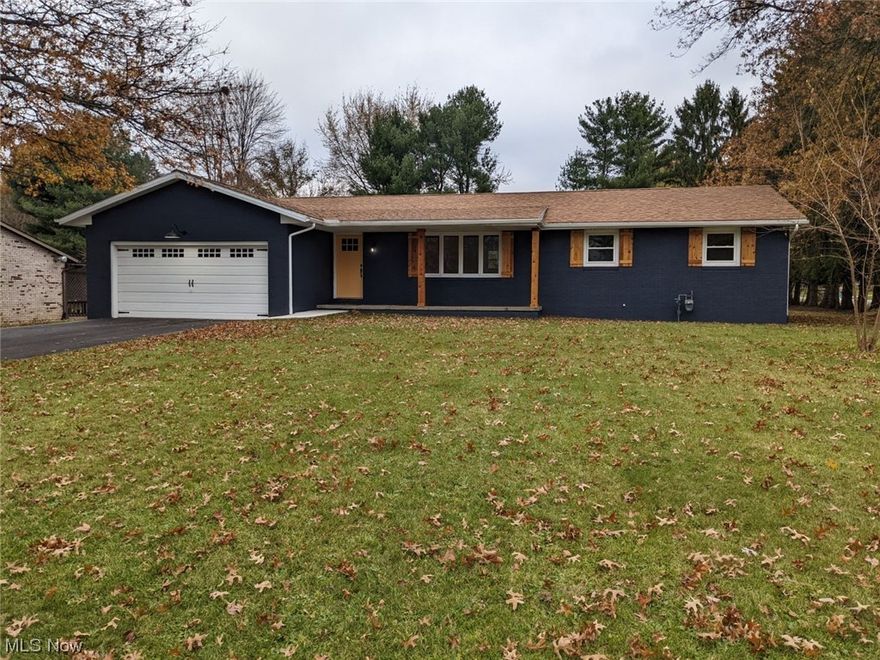 Meet your new Home! Gorgeous, completely updated, solid ranch, corner lot, flat half-acre yard, Lake township/Lake Schools. First floor living, first floor laundry with abundance of extra space, Private master with incredible ensuite bathroom, double sinks, double closet feature, plus private access to your own deck to enjoy your morning coffee and relaxing sunsets. Amazing kitchen open to the center of the home, beautiful stone countertops, custom cabinetry, island with seating, perfect for entertaining family and friends. Another new full bathroom and generous bedrooms down the hall. Full finished basement is the perfect rec or theatre room, and an additional large bonus room with closet can easily be a 4th bedroom or complete home office. Additional utility access area with a ton of storage for all your holiday decorations, memorabilia, etc.. Attached 2 car-garage, inviting front-porch, wonderful backyard space, convenient location for shopping in Green, Hartville, North Canton, and quick interstate access. Great area for walking/biking in the Laurel Oaks/Hidden Knolls Estates neighborhood. Move right in and start decorating! Mostly everything new or recently updated throughout, plus buyer will receive home warranty for added peace of mind.  Must See! A Beautiful house that feels like home!