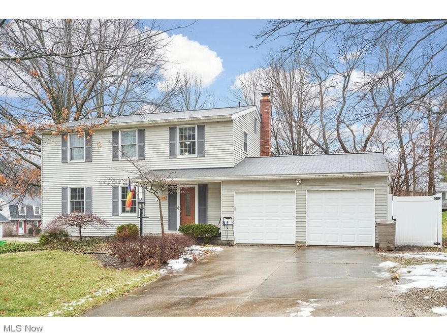 Munroe Falls colonial with family room addition. Sunroom has a wood burner. 4  nice size bedrooms, 2 1/2 bathrooms, 2 car attached garage. Kitchen is open to family room & sitting room. Sitting room has a fireplace. There is a wrap around breakfast bar. Family room has lots of natural light. There is also a dining room and living room. Corner lot with deck and patio. Side yard is fenced. Hot water tank (2021), fencing (2021), gutter guards (2022), roof (2010), furnace (2010), dishwasher (2021).